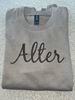 Picture of Alter High School - Adult/Unisex - Softstyle Crewneck w/ Brown Glitter Logo by Gildan SF000 -  Brown Savana or Sand